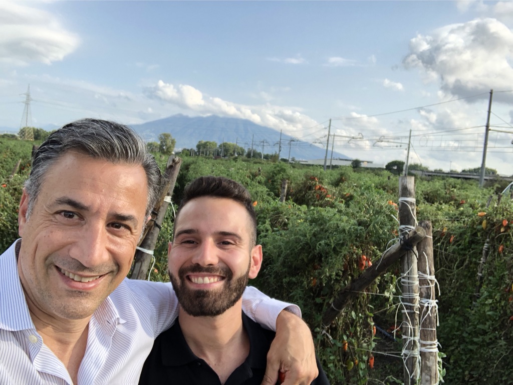 Fred Mortati and Antonio Spatuzzi, the head of production at Ciao, in a San Marzano field with Mt. Vesuvio behind them.