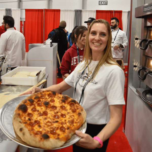 Cheryl Crawford holding her NY Artisan pizza