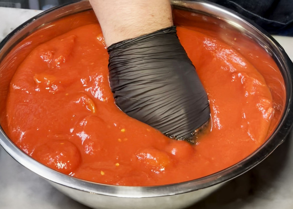 Hand Crushing Tomatoes